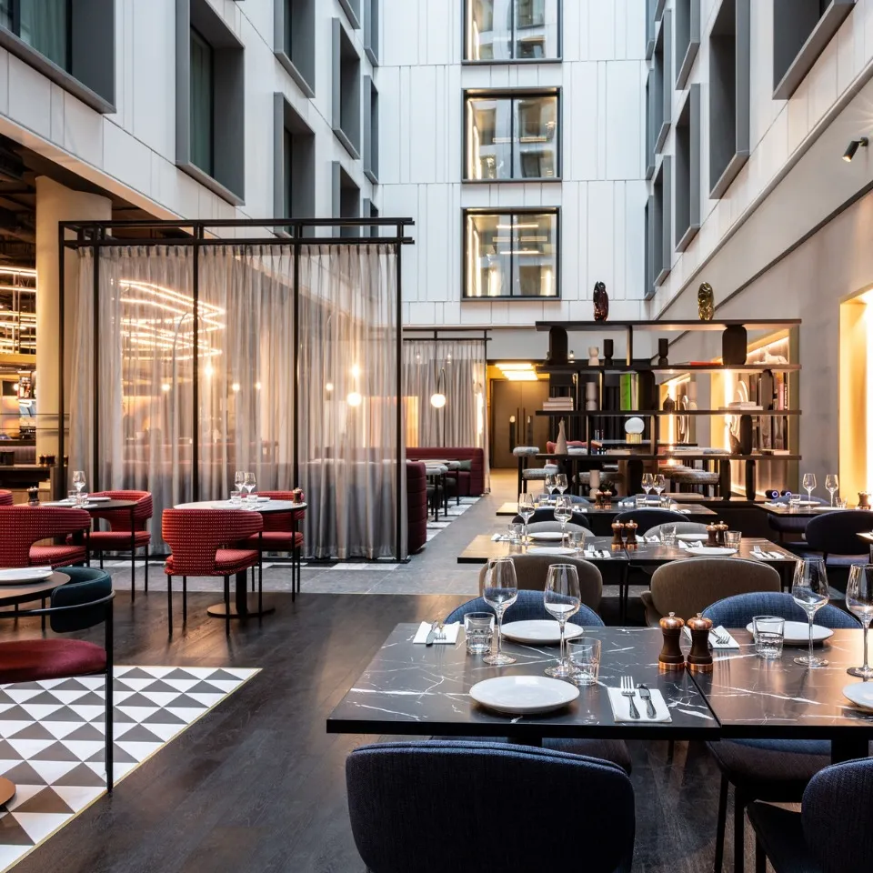 Tribe Table Restaurant with view of the internal atrium at the new Tribe Hotel at Manchester Airport