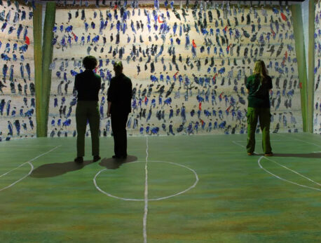 People viewing the Lowry 360 exhibition of Going to the Match at the Lowry in Salford.