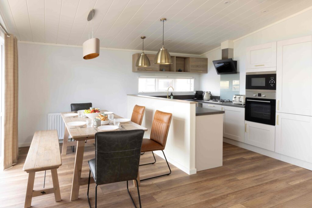 Kitchen and dining area at Hilltop Cabins at Lost Shore Edinburgh