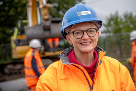 Mayor of Greater Manchester Bev Craig in a blue hard hat at Golborne station.